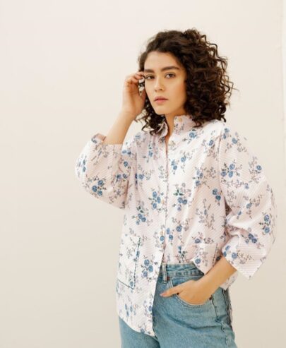 Absolute cotton top with collared button-down shirt with pocket and top stitch detail on front and kimono cutline.